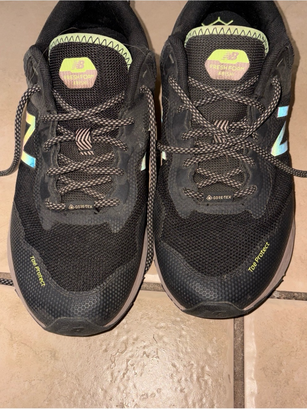 New Balance Black Trail Runners with Neon Yellow and Iridescent Accents